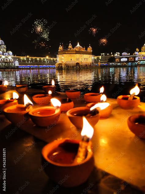 Golden Temple Amritsar lit by Diya and fire crackers Guru Purab ...