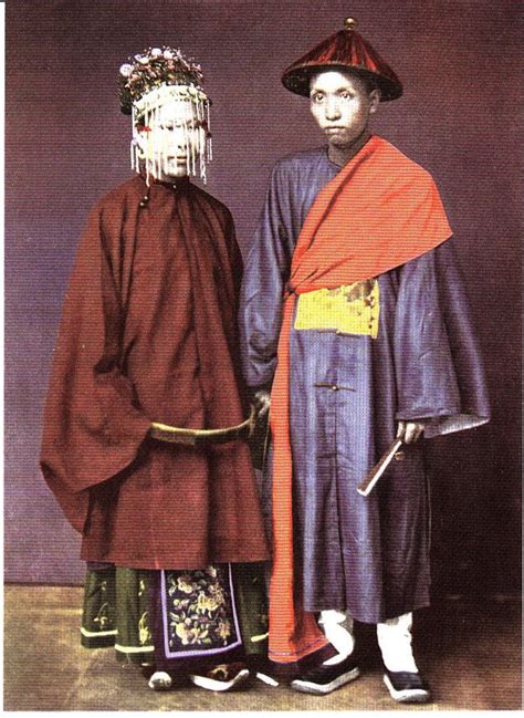 two men dressed in costumes standing next to each other