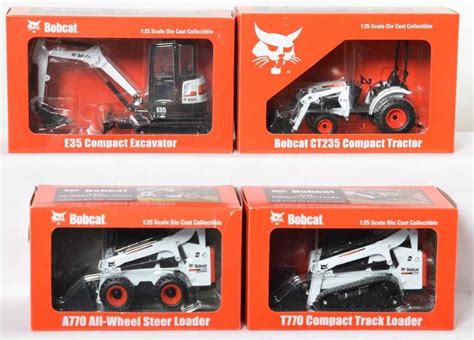 Four Bobcat 1:25th diecast toys in original boxes