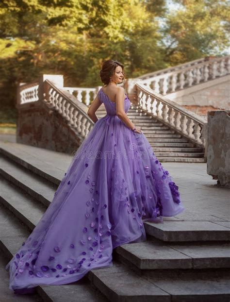 Girl in Gorgeous Purple Long Dress Standing on the Stairs Stock Photo ...