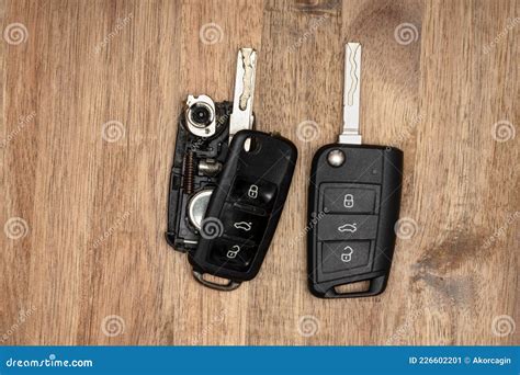 Broken or Damaged Car Key Fob on Wooden Background. Repair of Broken or ...