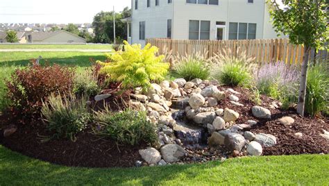 Berm Landscaping Idea with Water Feature