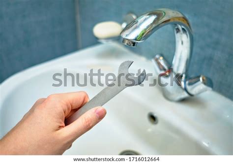 Fixing Sink Faucet: Over 5,988 Royalty-Free Licensable Stock Photos ...