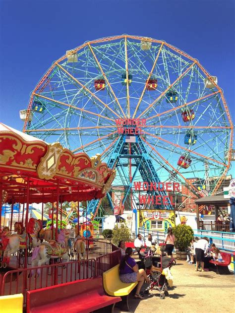 an amusement park ride with people sitting on it