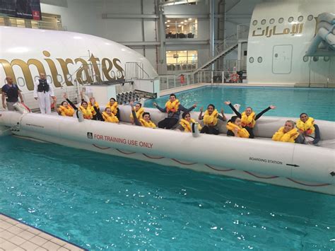 a group of people in life jackets on an inflatable raft