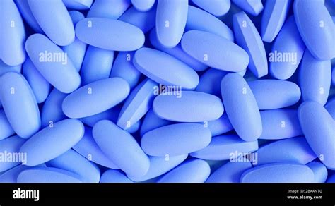 Heap of blue oval shaped pills for background and banner Stock Photo ...