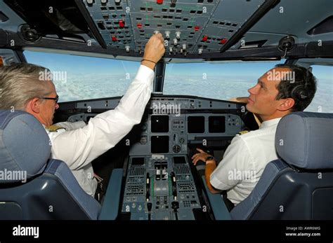 Pilots in the cockpit of an Airbus 321, in flight Stock Photo - Alamy