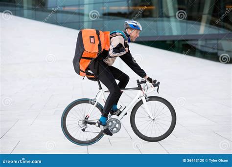 Male Cyclist With Backpack Riding Bicycle Stock Photo - Image: 36443120