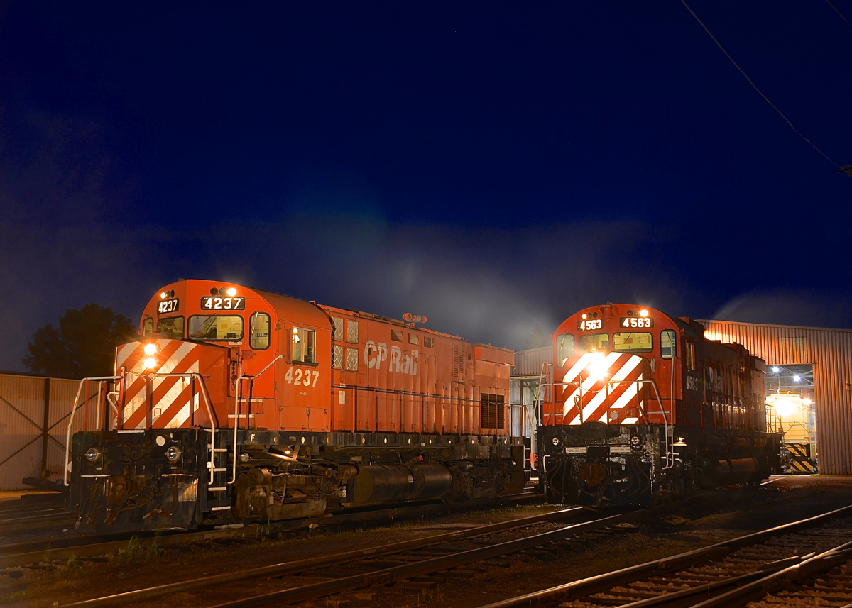 Class lights lit on a pair of MLW Centuries, a bit of smoke too. MLW's CP 4237 (C424) and CP 4563 (M630) both have their class lights lit as part of the 'Illuminated Trains' night shoot at Exporail. Both units are idling so there is some smoke as well.