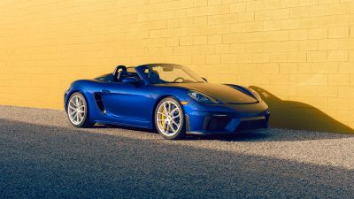 Porsche 718 Spyder, 5K, Yellow background, Brick wall