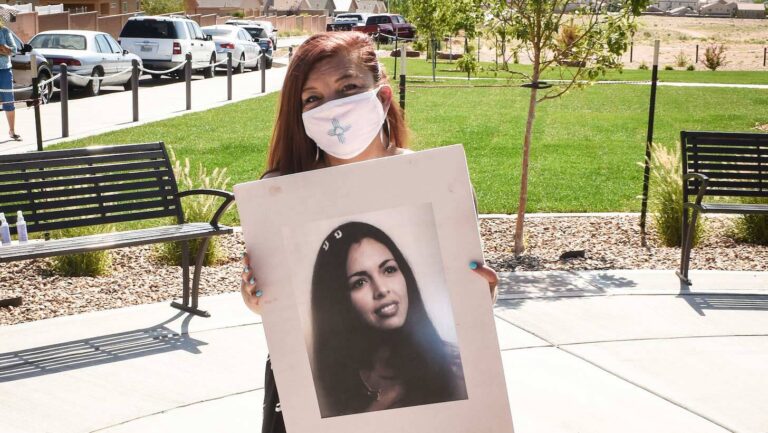 Frederica Garcia holds a photo of Doreen Marquez