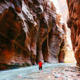 man in river canyon