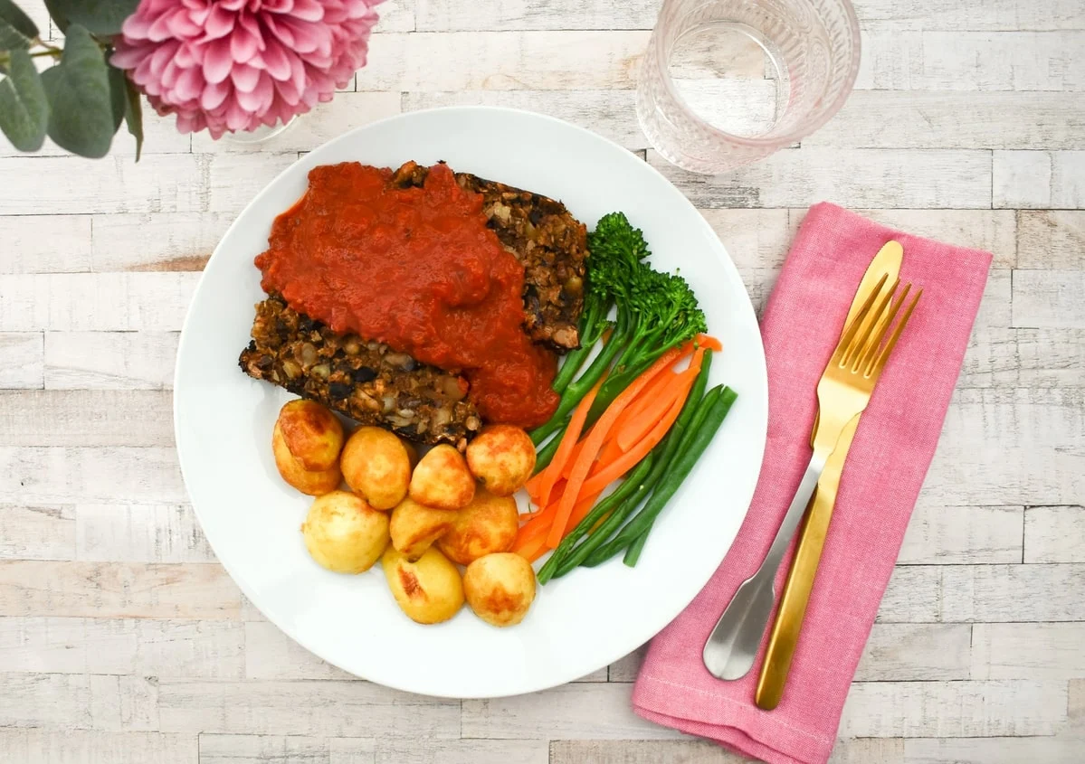 Mushroom nut roast with red pepper sauce.