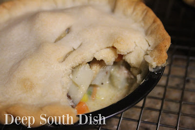 An old fashioned chicken pot pie, made with a thick & creamy roux & veggies, encased in a flaky double crust.