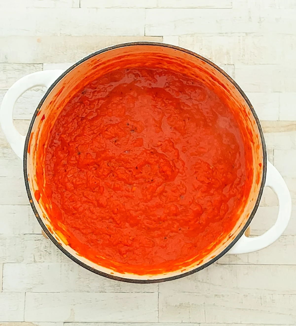 red pepper sauce for nut loaf in a pot.