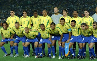 The Brazilian team: bottom row from left, Ronaldinho, Ronaldo, Roberto Carlos, Kleberson, Rivaldo, Cafu, Junior, Ricardinho and Luiazo. Top row from left Lucio, Edmilson, Roque Junior, Gilberto Silva, Marcos, Kaka, Vampeta and Anderson Polga pose prior to the start of the 2002 World Cup final soccer match between Brazil and Germany Sunday, June 30, 2002 in Yokohama, Japan. (AP Photo/Luca Bruno)