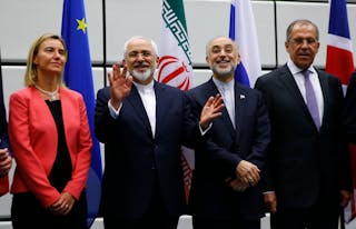 Iranian FM Zarif gestures next to High Representative of the European Union for Foreign Affairs and Security Policy Mogherini, I