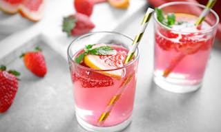 strawberry Glasses of refreshing drink on table