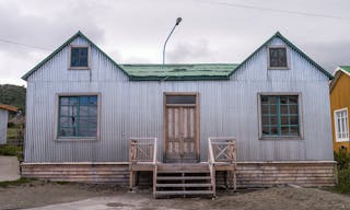 House with corrugated metal wall