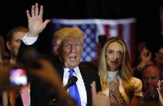 Republican U.S. presidential candidate and businessman Donald Trump waves after speaking to supporters following the results of 