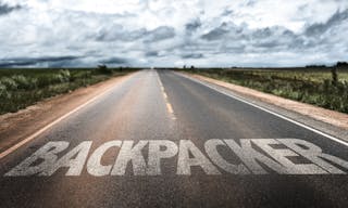 Backpacker written on rural road — Photo by gustavofrazao