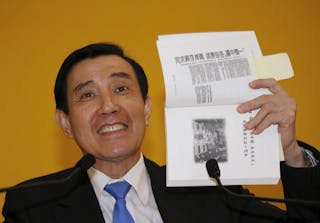 Taiwan's President Ma Ying-jeou speaks at a news conference after a meeting with Chinese President Xi Jinping at a summit in Sin