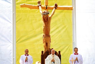 Pope Francis prays as he leads a Holy Mass at the stadium in Sarajevo