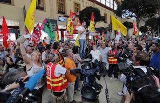 French SNCF unionists and striking railway workers gather during a strike against a planned reform of the sector at Marseille ra