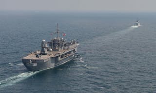 The U.S. 7th Fleet flagship USS Blue Ridge (LCC 19), left, and the China's People's Liberation Army Navy (PLA(N)) guided-missile