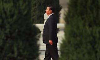 Chinese President Xi Jinping walks toward the Monument to the People's Heroes during a ceremony marking Martyrs' Day at Tiananmen Square in Beijing Friday, Sept. 30, 2016. Xi and other Chinese leaders presented flower baskets and scores of ordinary people filed up to lay a single flower each on Friday at the monument to mark Martyrs' Day. (AP Photo/Mark Schiefelbein)