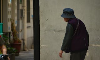 Shanghai, China -November 16, 2019: Old age, Old woman walk alone.the view from behind. An elder Chinese lady walking on the str