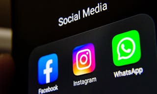 Social media products from Facebook company: Facebook, Instagram, WhatsApp apps on the smartphone screen. Stafford, UK - Septemb