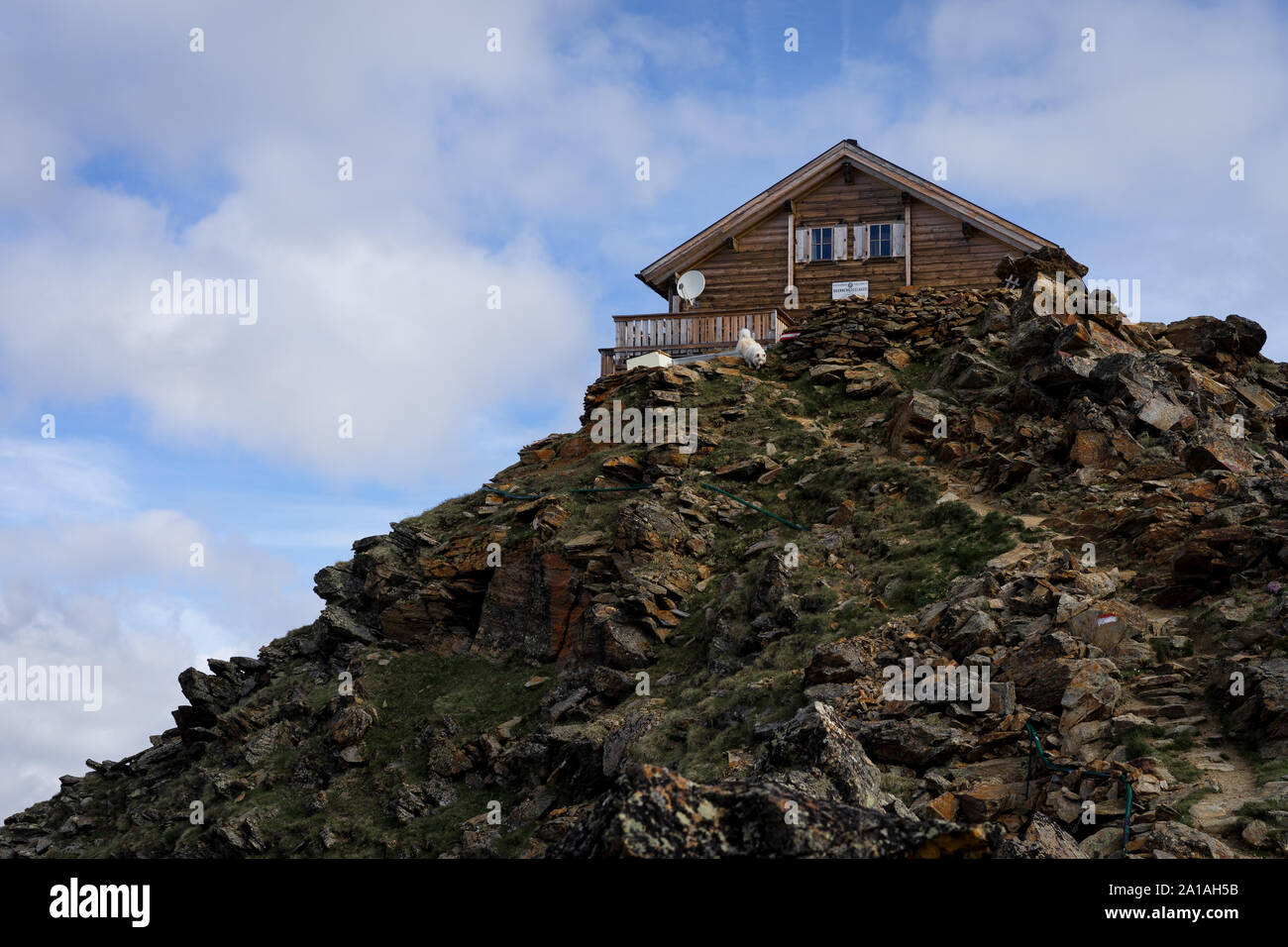 A beautiful house on the top of a mountain in summer. Stock Photo