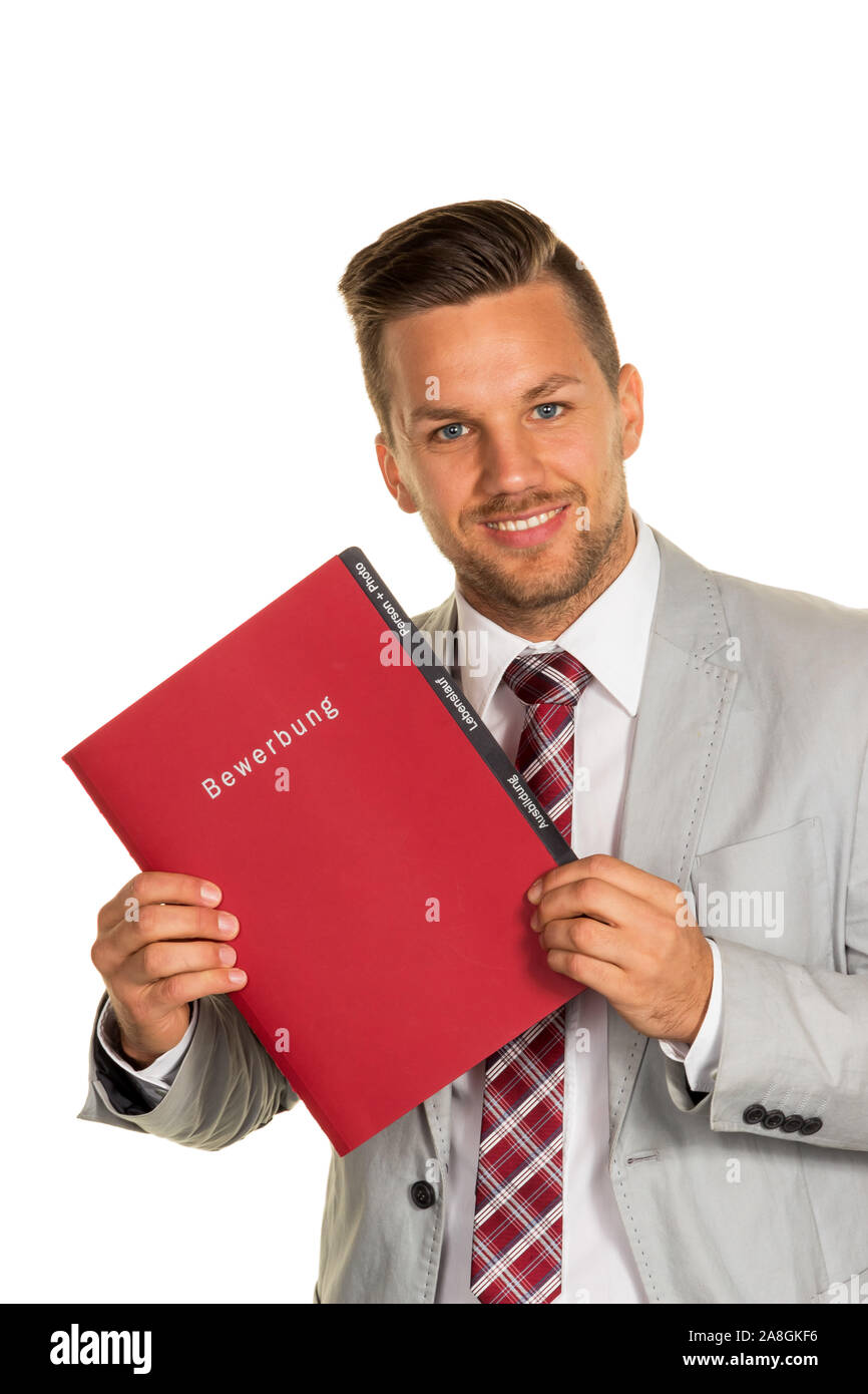 Ein junger Mann mit einer Bewerbungsmappe in der Hand. Vorstellen bei einem Personalchef, 30, 35, Jahre, MR: Yes Stock Photo