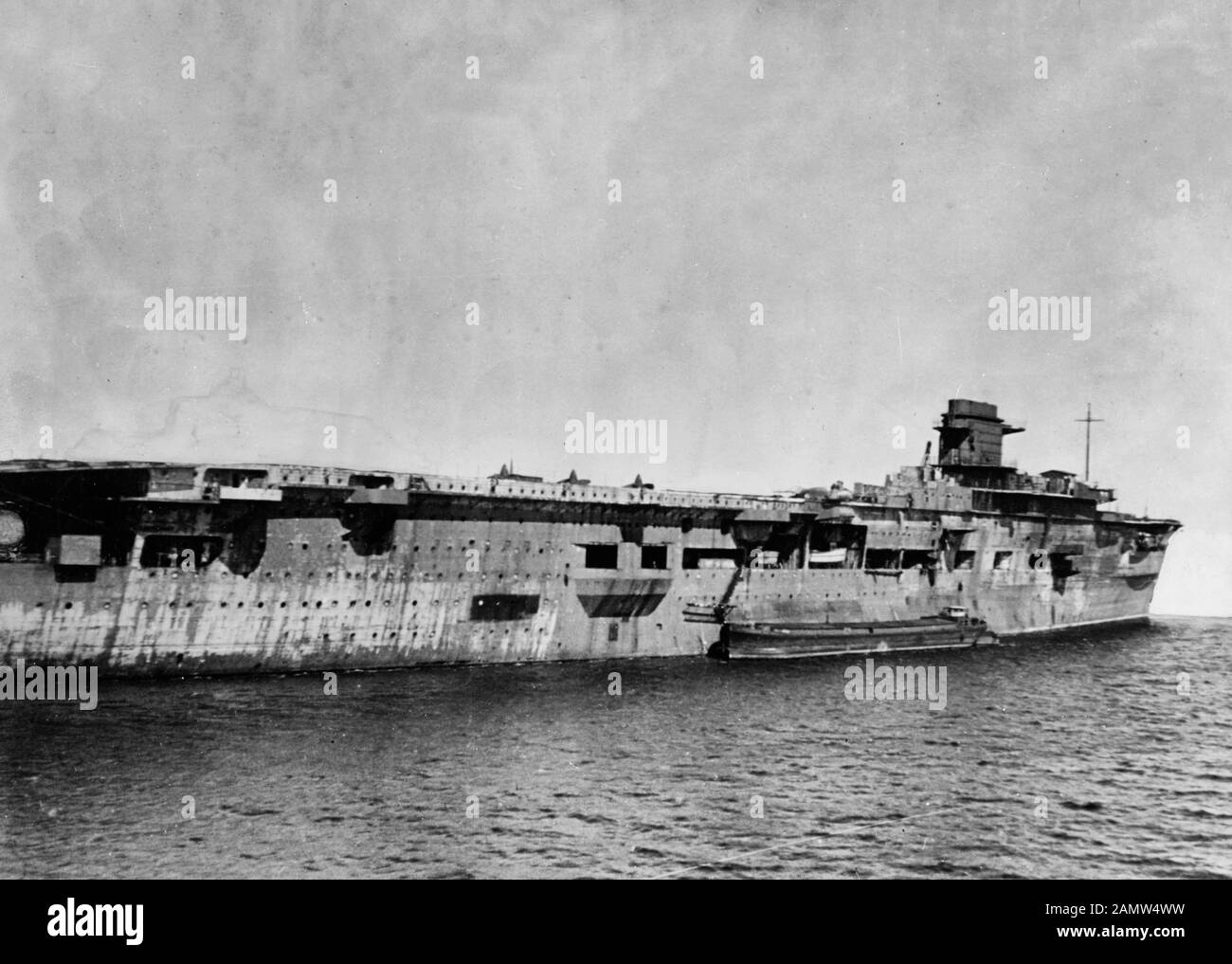 The former German aircraft carrier Graf Zeppelin on 5 April 1947 at Swinemünde (today Świnoujście, Poland) while in Soviet custody. The scuttled carrier had been refloated in March 1946 and was sunk as a target in the Baltic Sea on 16 August 1947. April 1947 Stock Photo