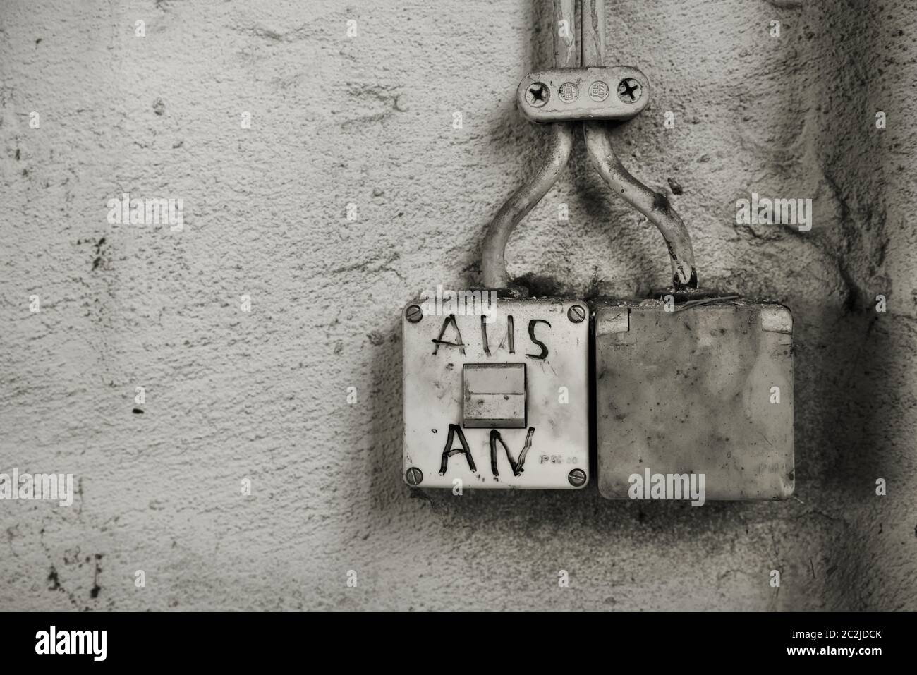 old light switch with the inscription 'on, off' in an abandoned factory in Magdeburg Stock Photo