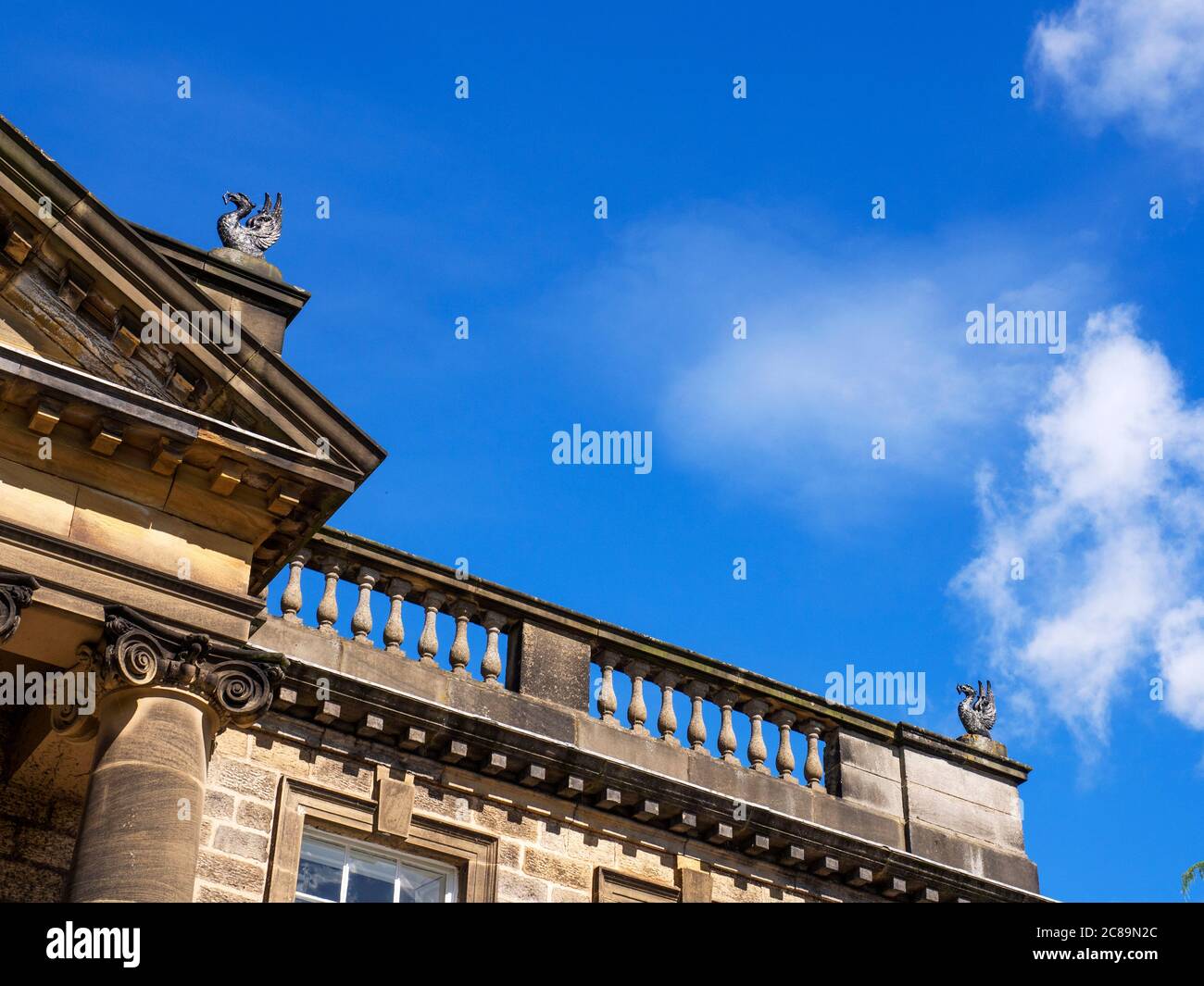 Architecture detail at Conyngham Hall showing balustraded parapet with phoenix finials Knaresborough North Yorkshire England Stock Photo