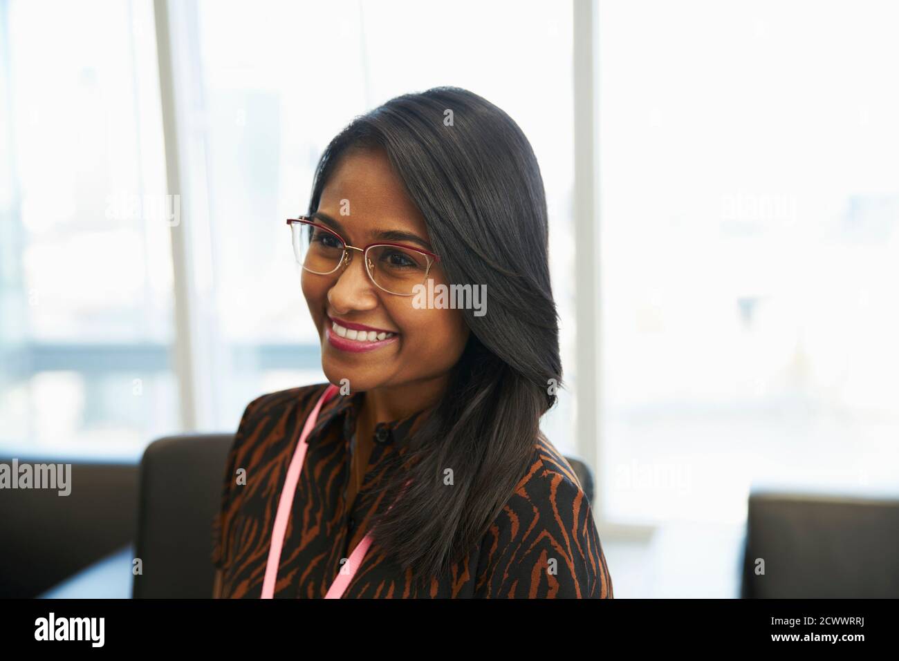 Smiling businesswoman in office Stock Photo