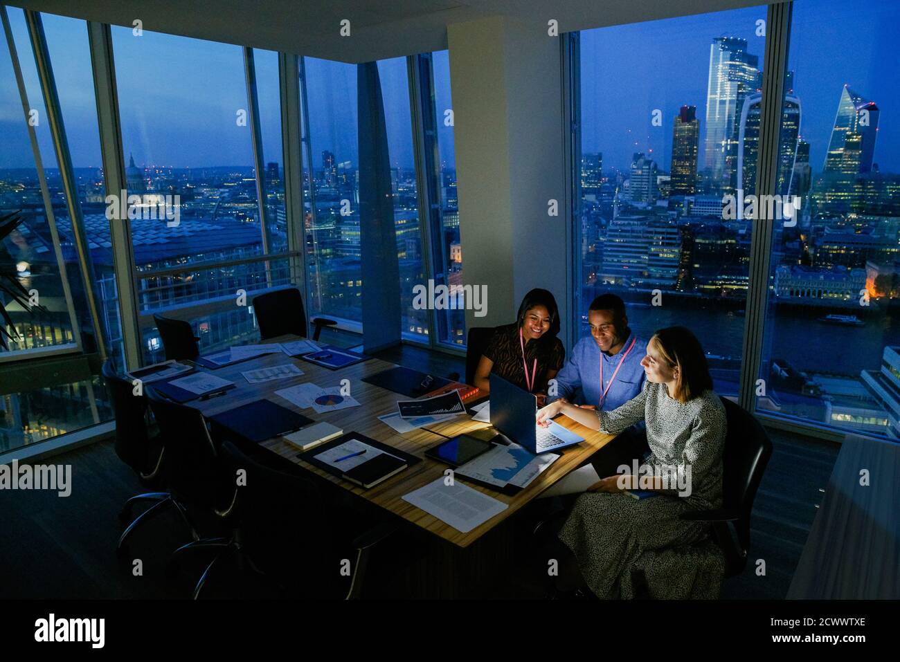 Business people working late in highrise office, London, UK Stock Photo