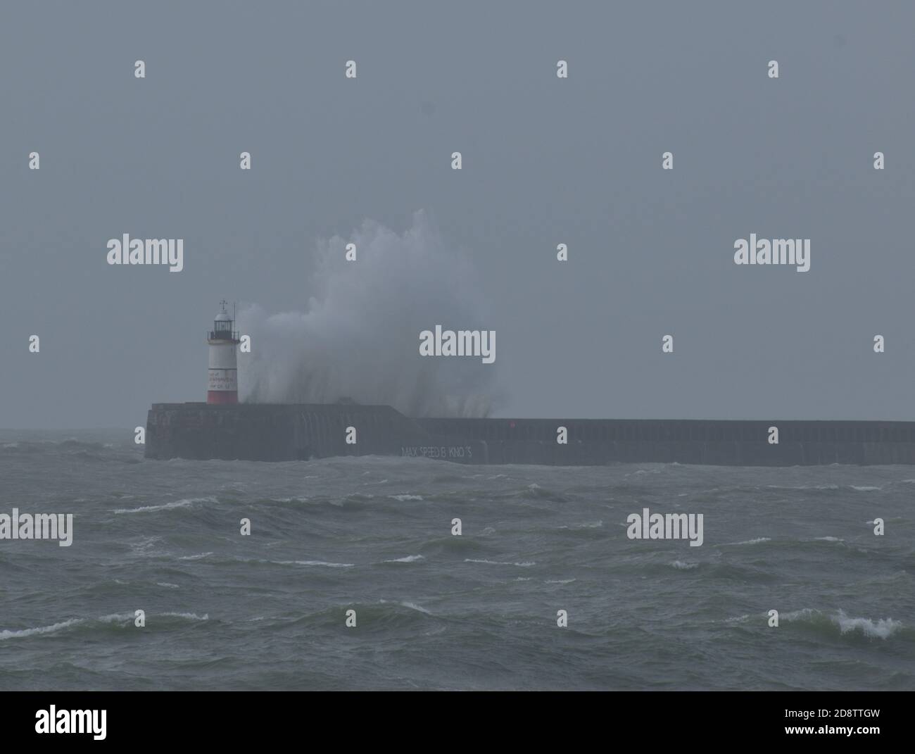 Waves crashing over Newhaven harbour wall and lighthouse 31st Oct 2020 Stock Photo