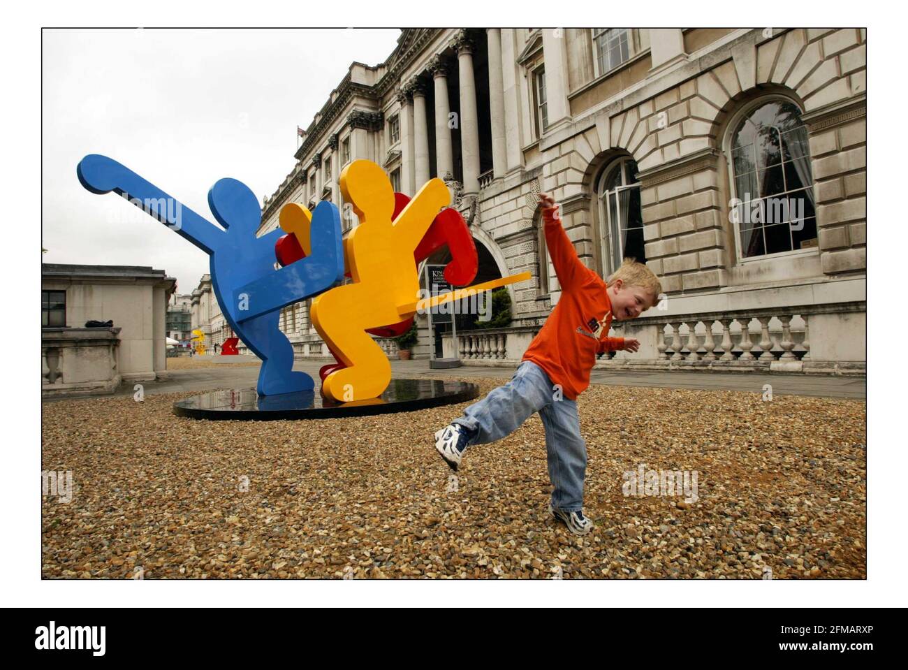 Children Play in and around the new Keith Haring open air sculpture show foat Somerset House in London they will be on show June 6 - 28 October.  pic David Sandison 2/6/2005 Stock Photo