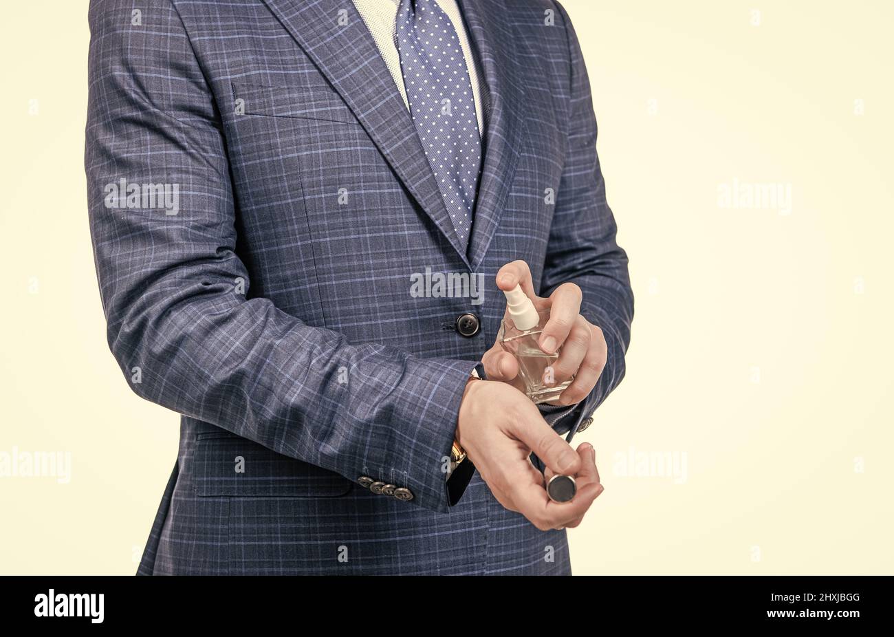 Pure luxury in bottle. Businessman apply perfume on wrist. Personal hygiene. Testing hygiene product Stock Photo