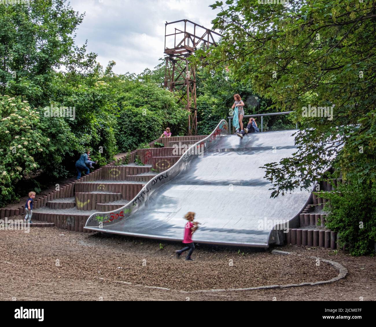 Metal Slide at the Lohmühle Children's playground, Alt-Treptow,Berlin,Germany. Situated on route of former Berlin Wall Stock Photo