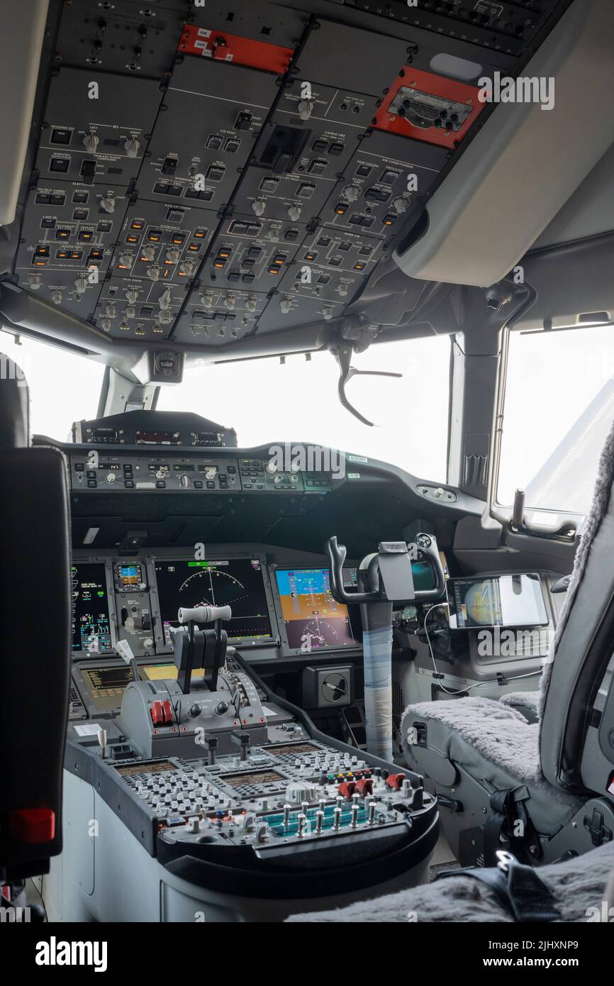 The instruments and screens in the cockpit of a Boeing 777X jet airliner, at the Farnborough Airshow, on 20th July 2022, at Farnborough, England. As a result of the fatal accidents and grounding of the 737 Max fleet around the world, Boeing is now recovering from a financial downturn. Stock Photo