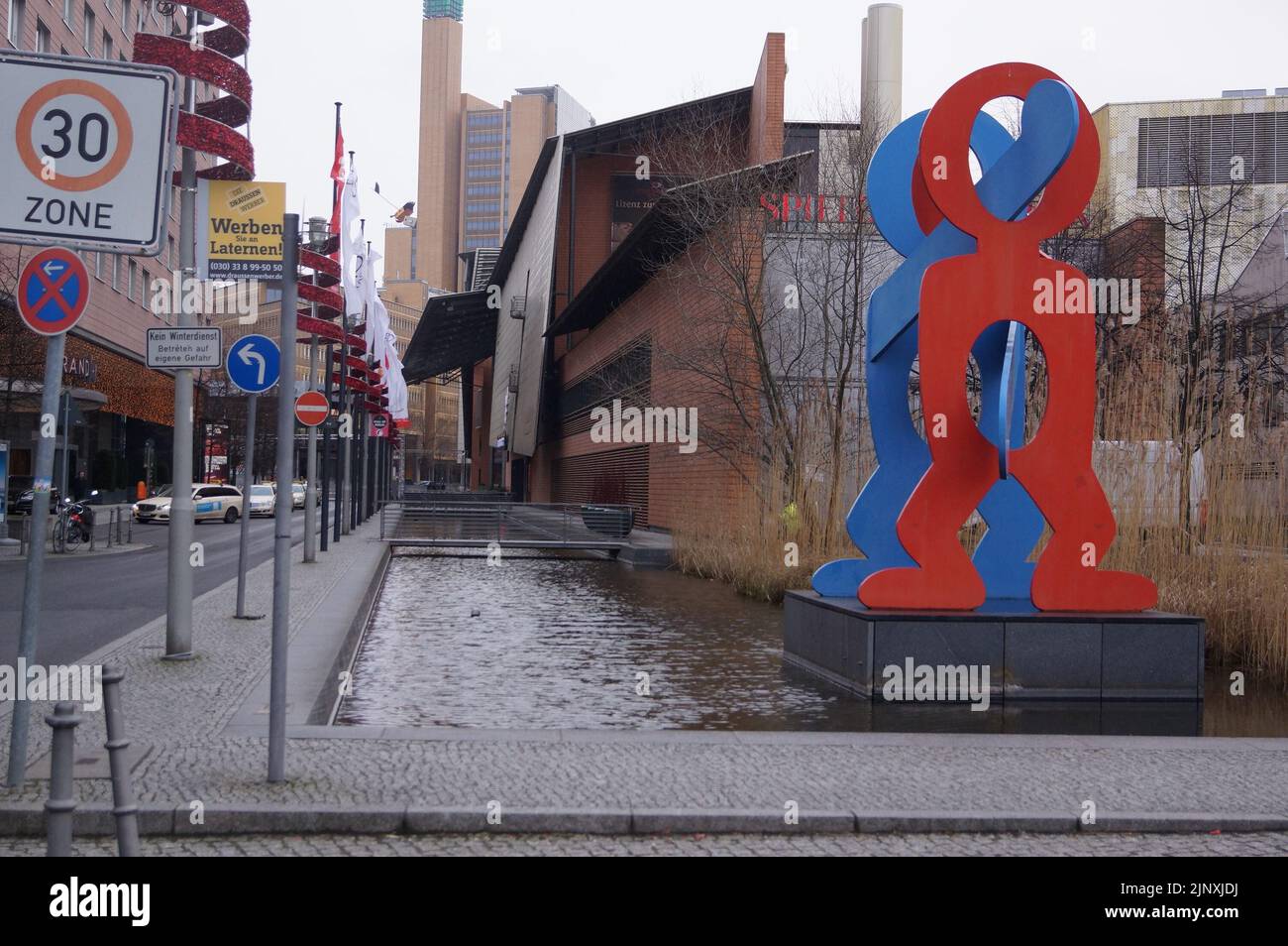 Berlin, Germany: the art installation 'Boxers' by Keith Haring in VoxstraÃŸe, erected in celebration of Berlinâ€™s birthday in 1988 Stock Photo