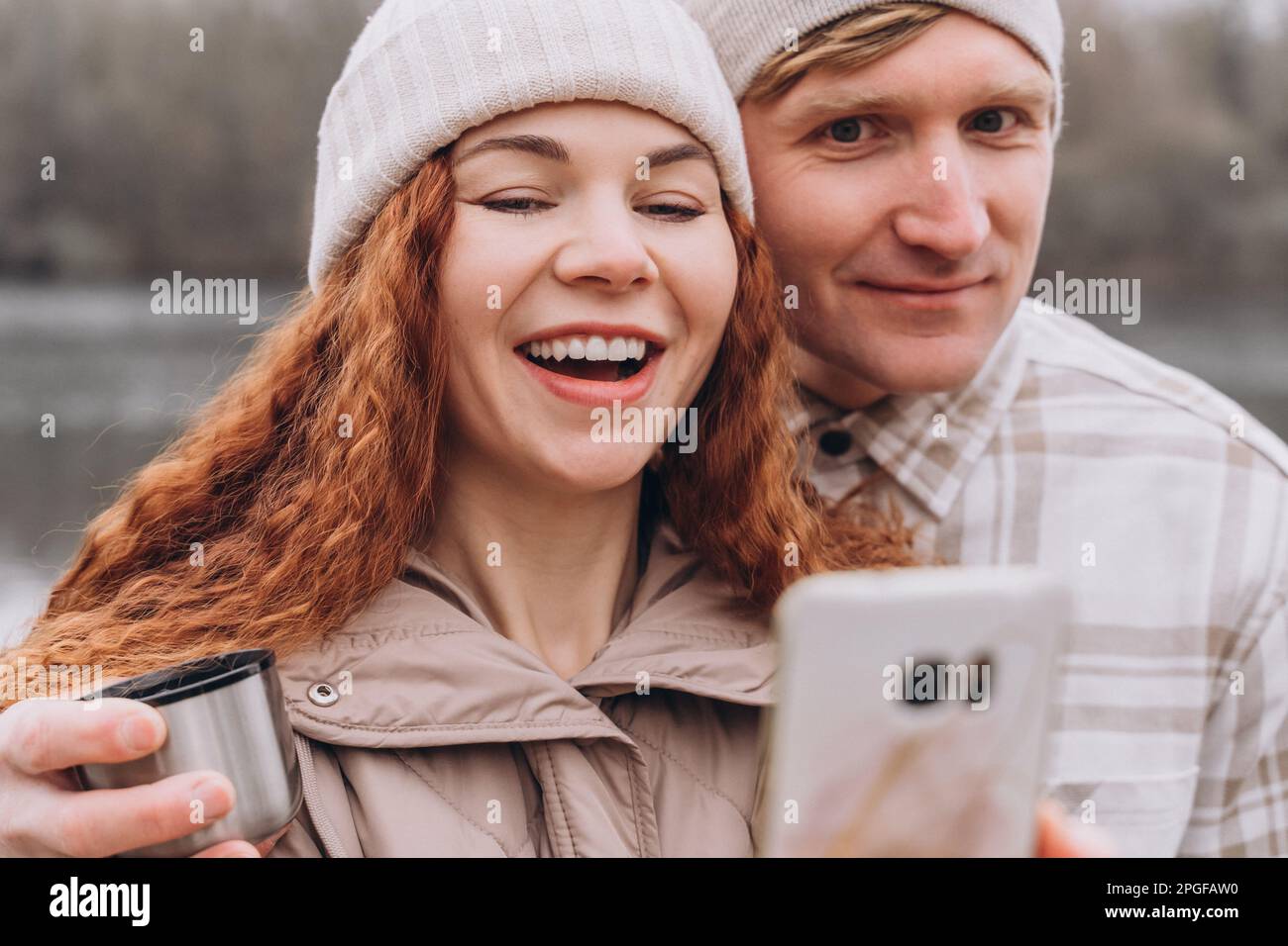 30-35 couple in love making selfie or video call while walking Stock Photo