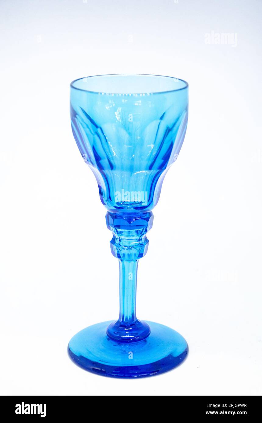 An antique, blue stemmed glass by Apsley Pellet isolated against a white background. Stock Photo