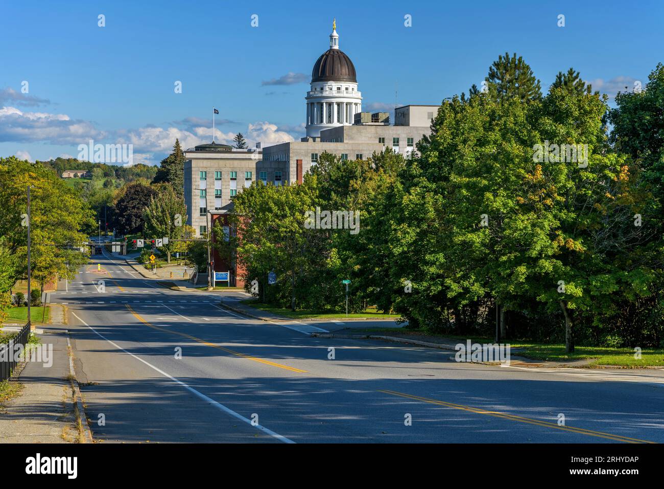 Capitol Street - A sunny Autumn day view of quiet Capitol Street at Downtown Augusta, with the dome of Maine Capitol Building towering in background. Stock Photo