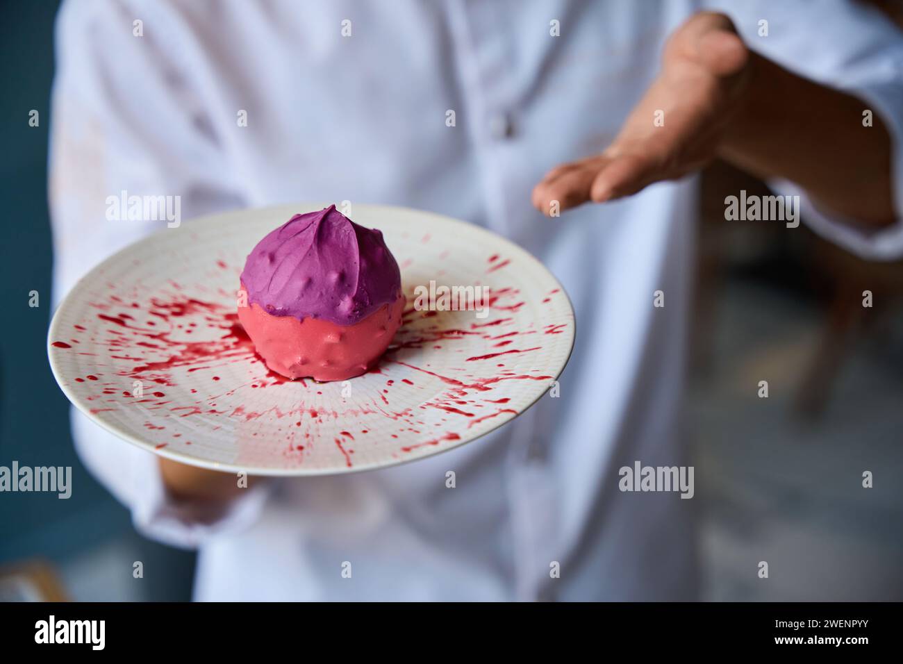 Chef presents an original fruit dessert Stock Photo