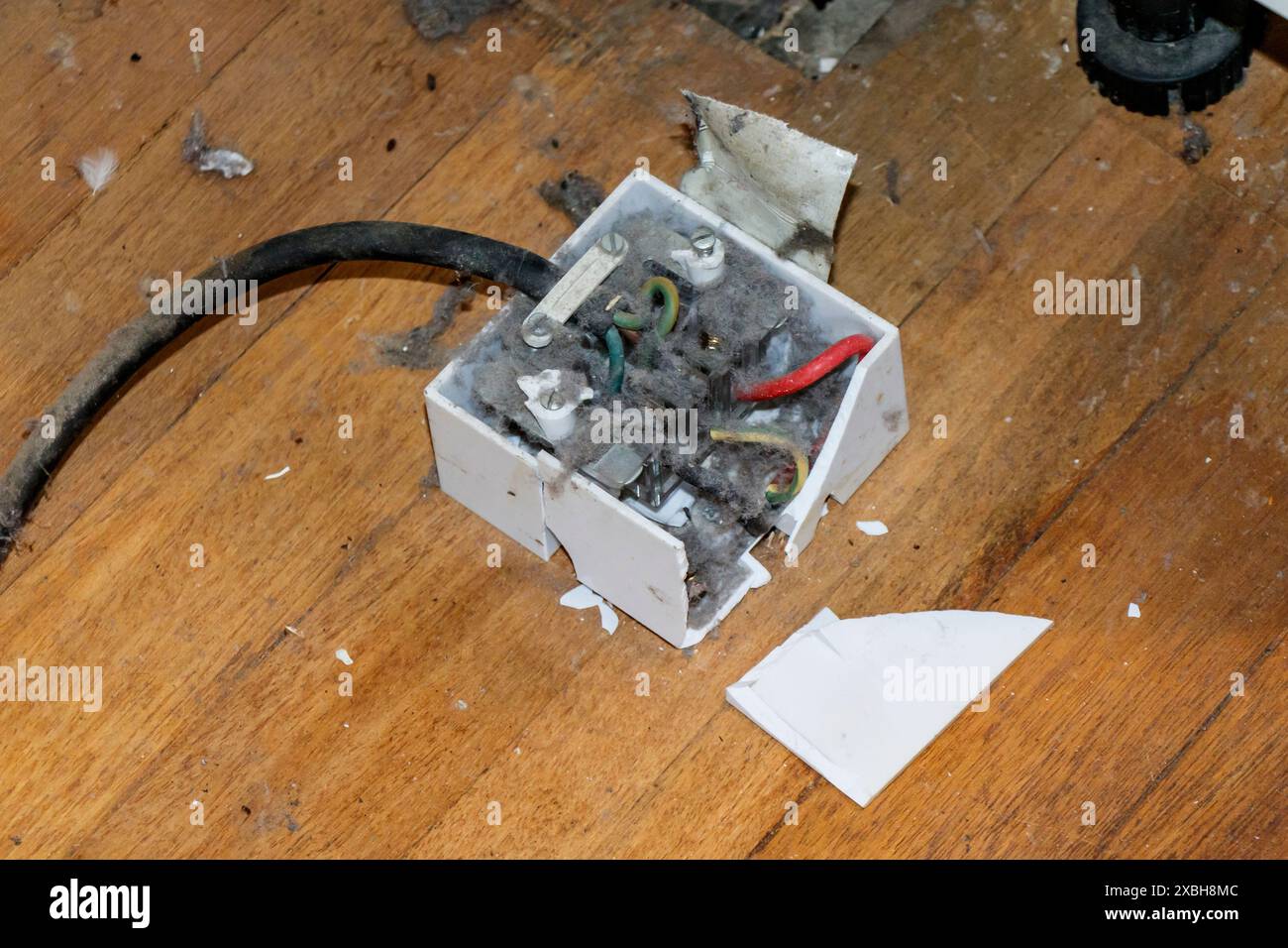 An illegally-fitted electric cooker point, London, UK Stock Photo